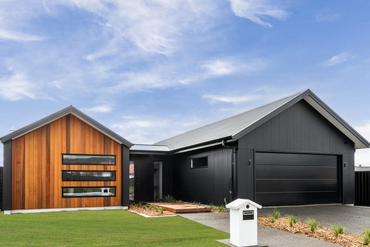 Dark-clad gabled home with timber accents, built by Palmer Builders in Hawke's Bay