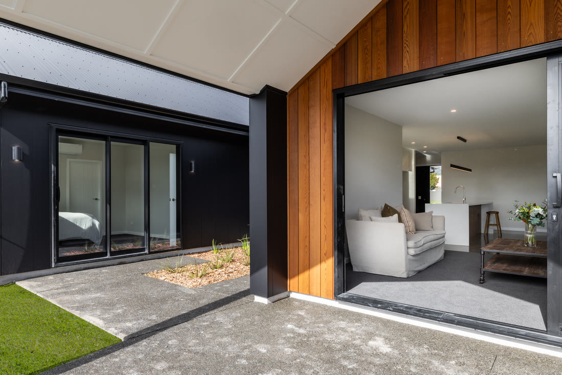 Living space opening to the outdoors through stacking doors